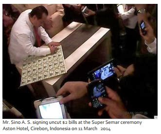 signing_uncut_2_dollar_bills.png